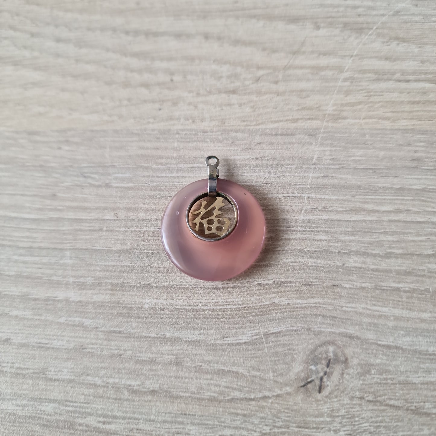 Chinese with rose quartz pendant