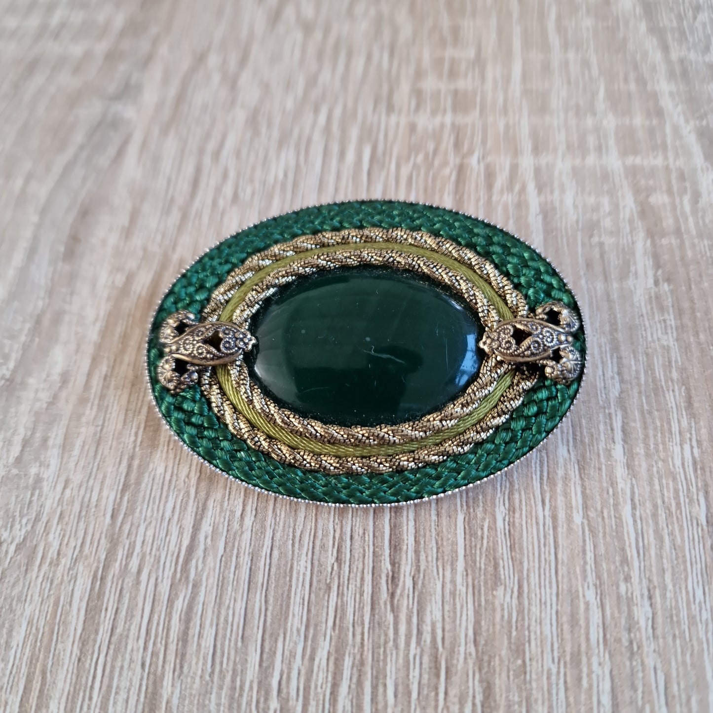 Large green brooches