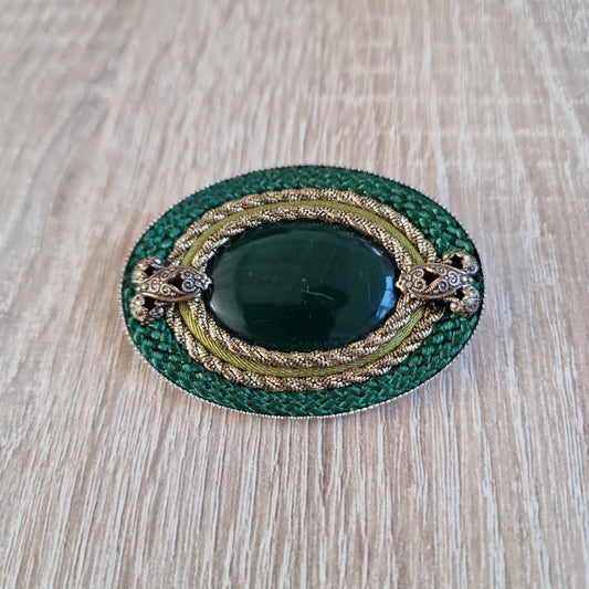 Large green brooches